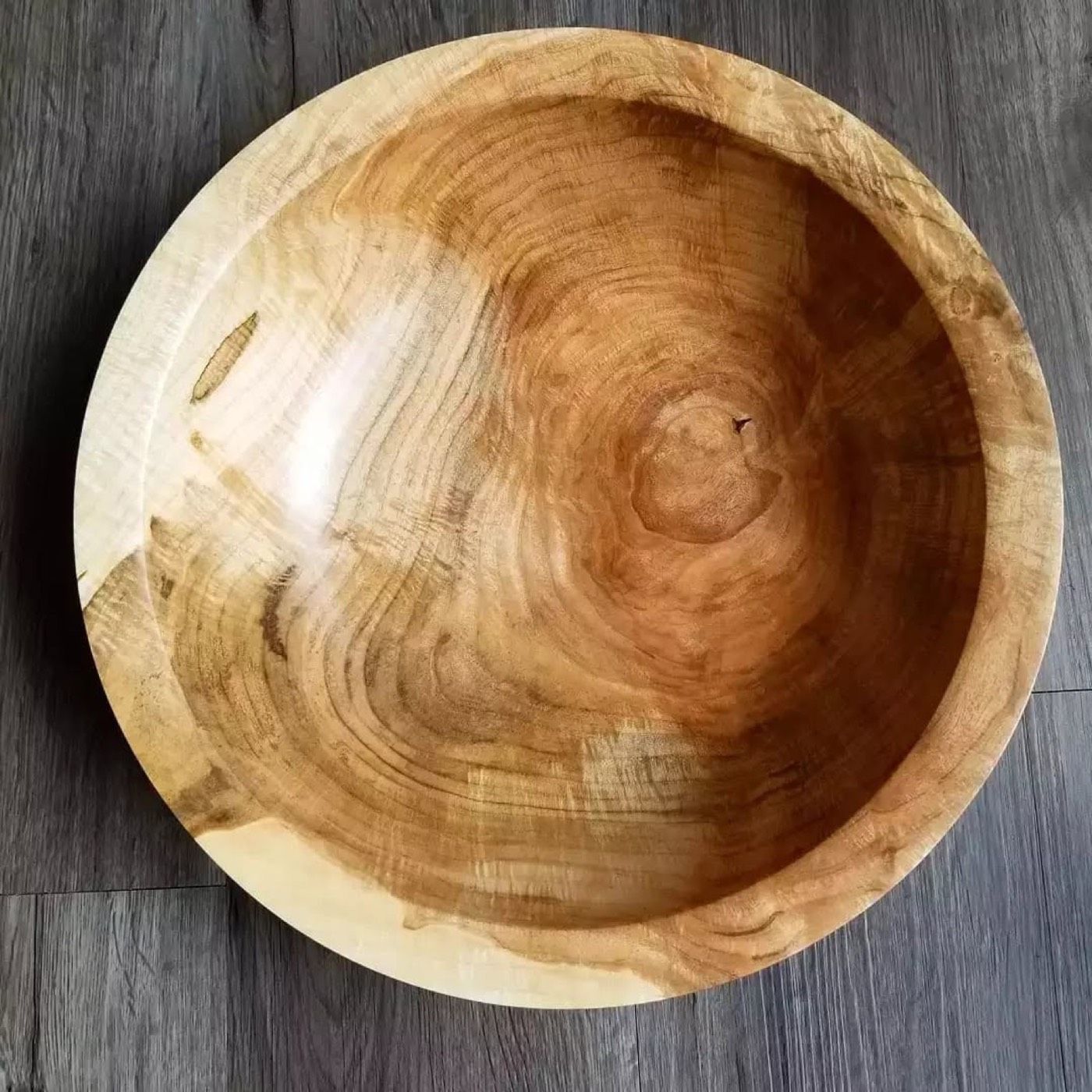 A 12.5 inch maple burl bowl with swirling grain and colour changes